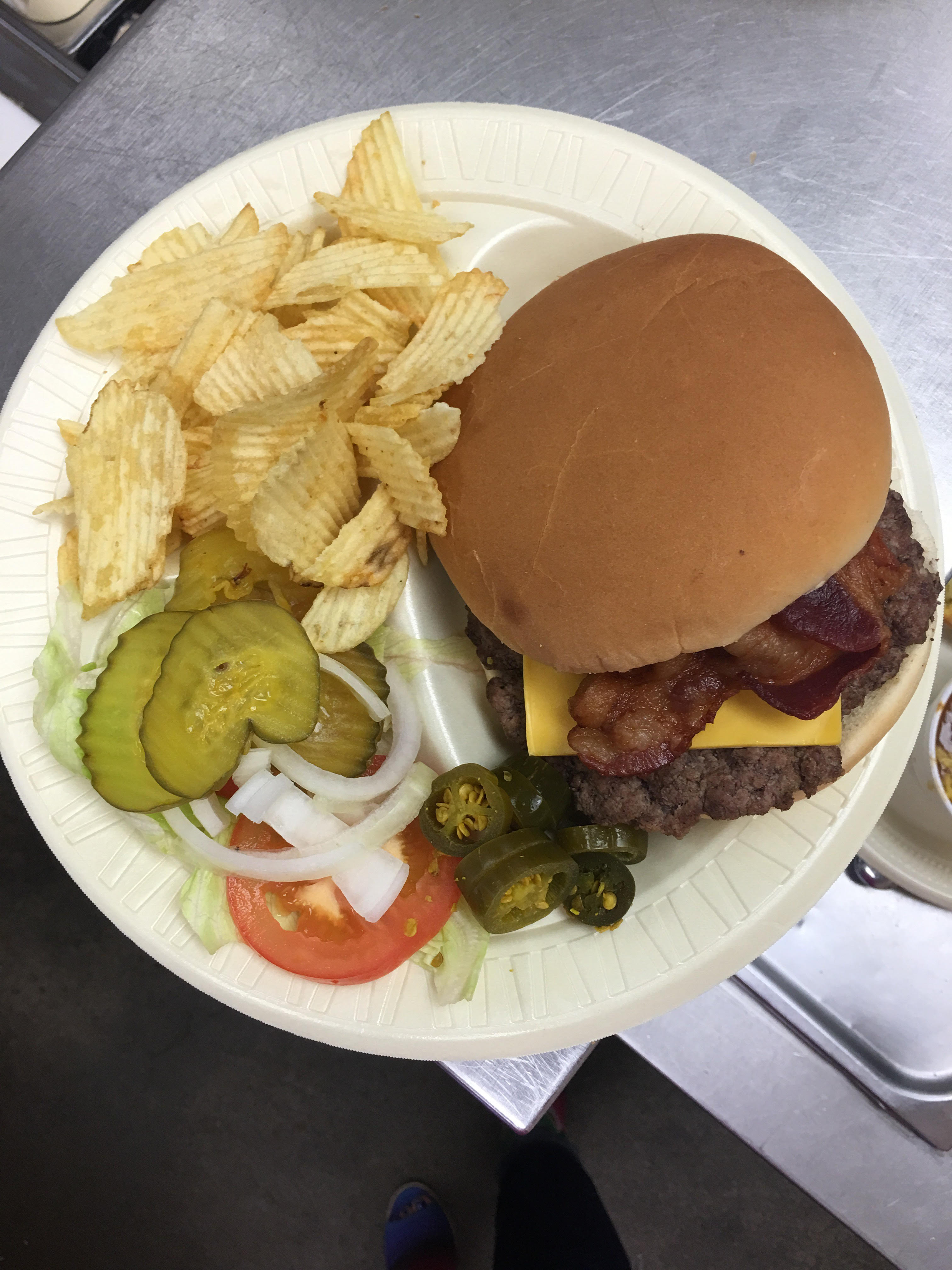 The Sticks BBQ — bacon cheeseburger overhead shot with jalapeños on the side, Brownwood TX
